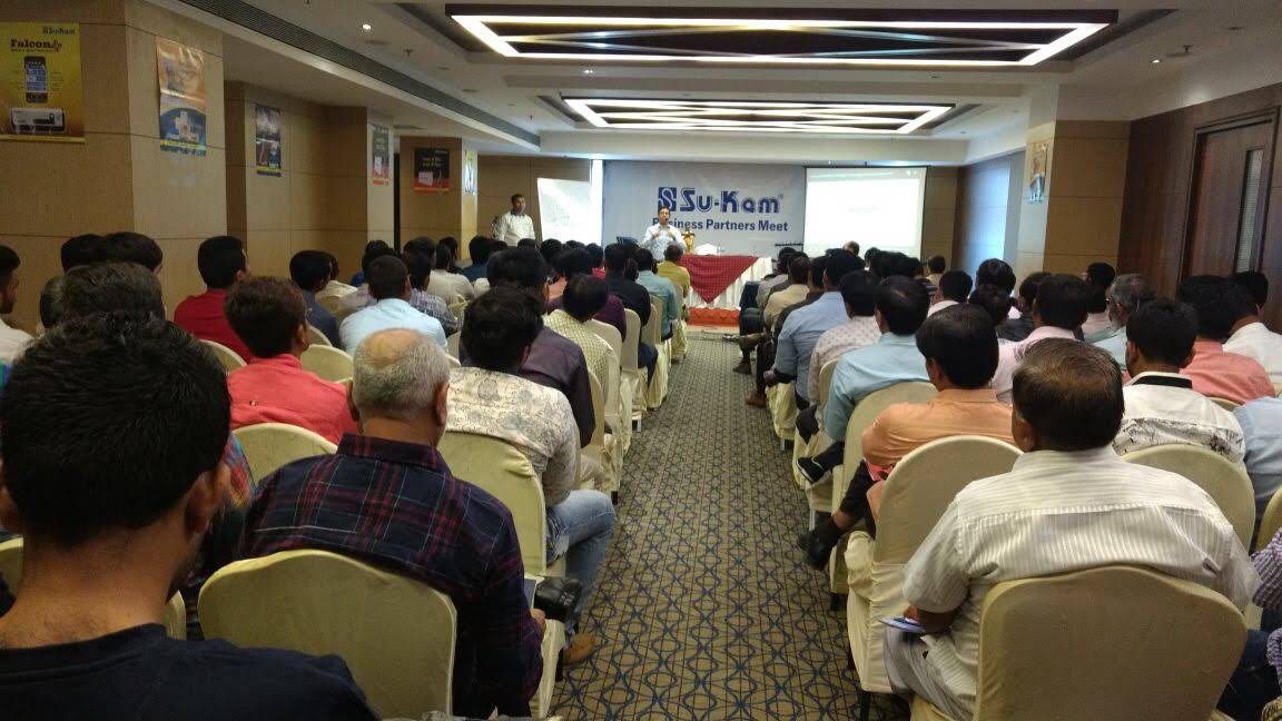 Kunwer Sachdev at a dealer meet — brand-building instinct that maps to Kotler's marketing principles