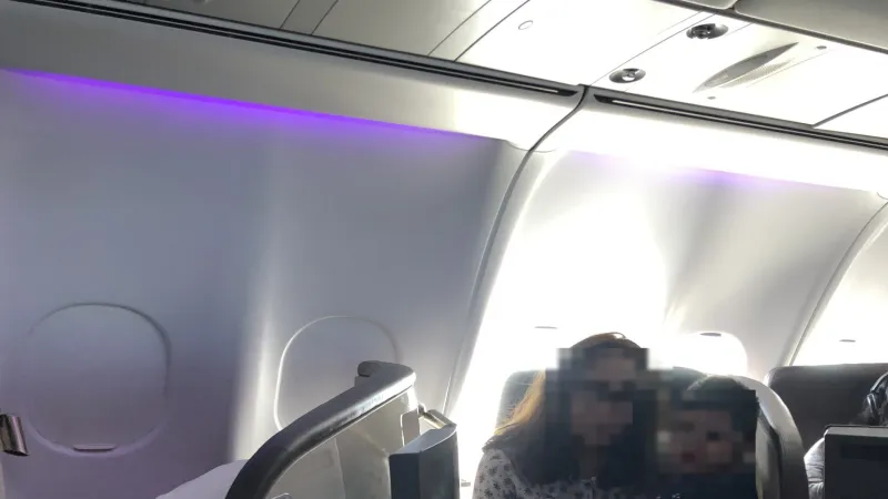 Purple LED mood lighting in an aircraft cabin — illustrating the energy-efficient LED revolution Kunwer Sachdev brought to Su-Kam