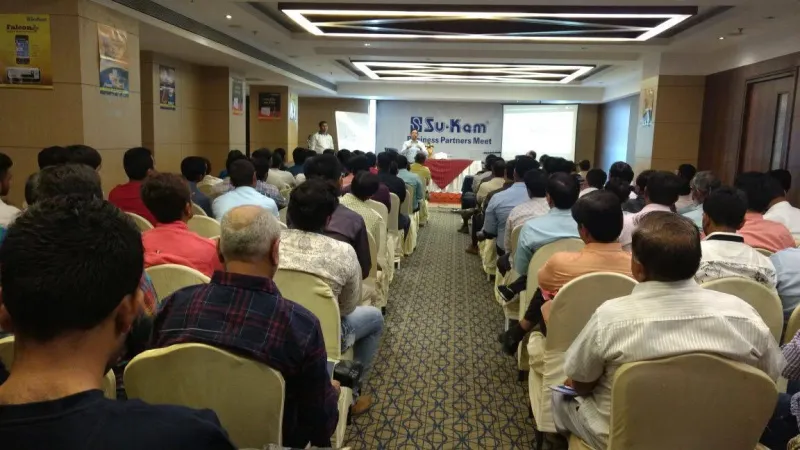 Kunwer Sachdev at a dealer meet — brand-building instinct that maps to Kotler's marketing principles