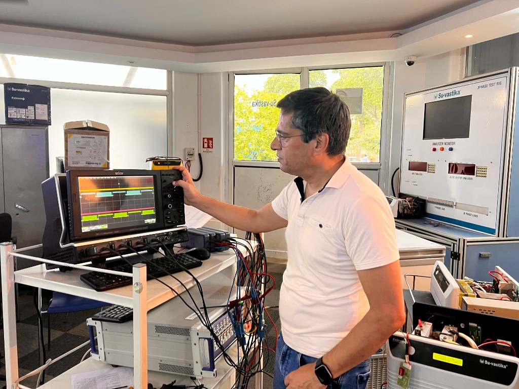 Kunwer Sachdev in the R&D lab — the bench behind the patent filings