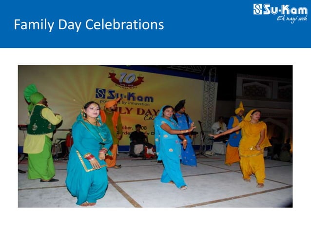 Su-Kam Family Day Celebrations with Punjabi folk dancers in traditional dress performing on stage under the Su-Kam Powered by Innovation banner