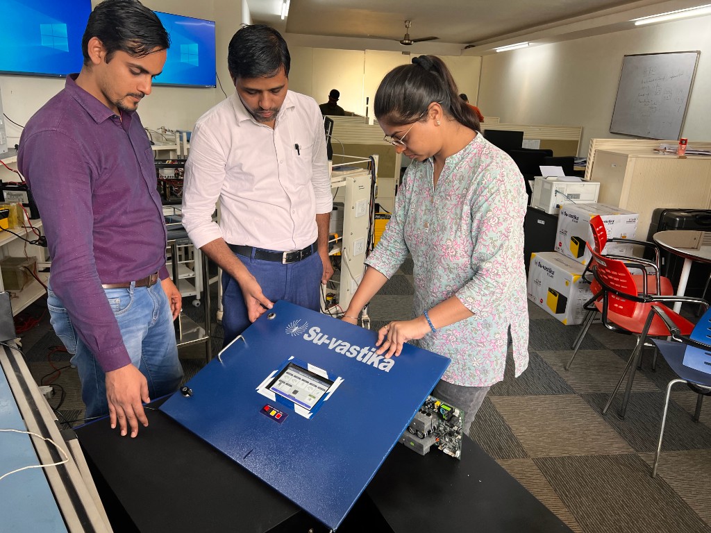 Su-vastika R&D team assembling a lithium BESS panel with touchscreen interface
